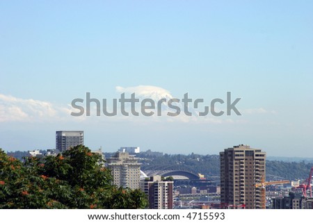 downtown seattle skyline with a rare view of Mt Raineer in the distance as seen from kerry park on queen anne hill