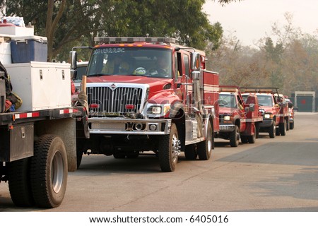 fire trucks line up for gas and diesel fuel and prepair to go battle the wild fires from the santiago canyon staging area