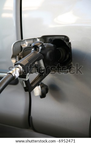 pumping gas into a car