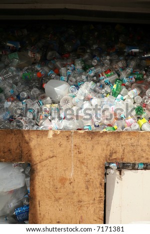 a recycling station filled with recycled empty plastic bottles