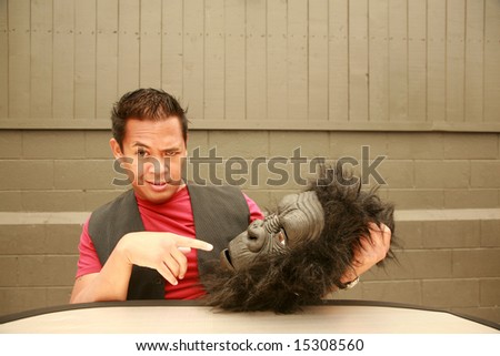 a male model makes a face at the request of the photographer to wear his Gorilla Costume Head
