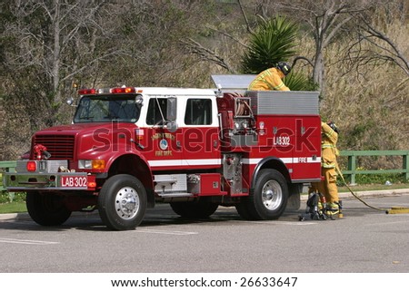 LAGUNA BEACH, CA - FEB 19: Firefighter recruits pack up after fire fighting drills at the local Fire Department training area on February 19, 2009 in Laguna Beach, California.