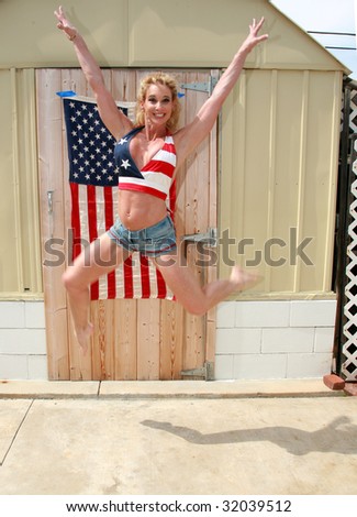 a happy woman jumps for joy because she is free and in america on the forth of july