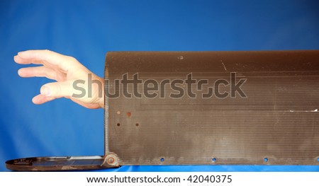 a hand reaches out from inside a mail box