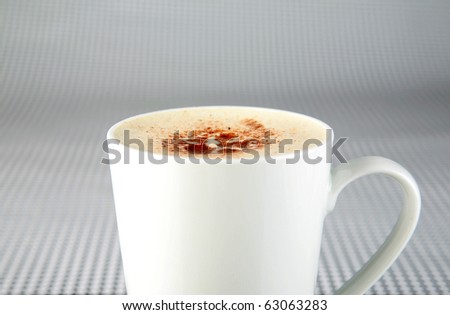 coffee or espresso or cappuccino in a white coffee mug on a black and white background
