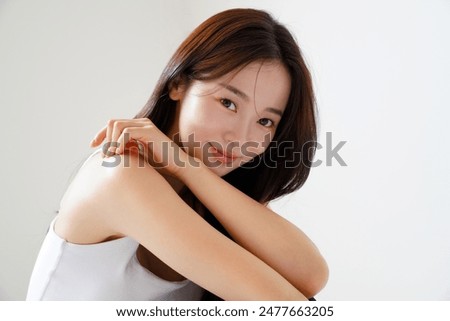 Similar – Image, Stock Photo Beautiful young Asian woman walking the street of historic European town with palm trees. Female tourist from China traveling in Europe, smiling. Exchange student.