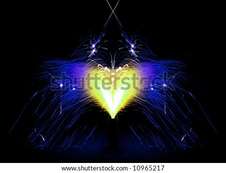 Fireworks giving off a shower of blue & yellow sparks in the shape of a heart - Symmetry.
