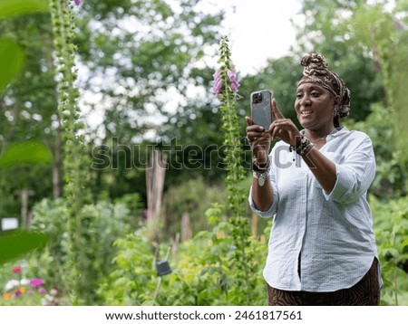 Similar – Image, Stock Photo A woman photographs a beautiful autumnal forest