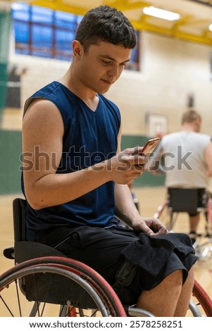 Similar – Image, Stock Photo Disabled athlete using phone