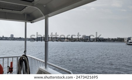 Similar – Image, Stock Photo View over the Warnow river to the city of Rostock in the evening