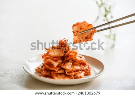 Similar – Image, Stock Photo Kimchi, fermented chinese cabbage in hot chili sauce , in bowl with chopsticks on rustic kitchen table. Close up