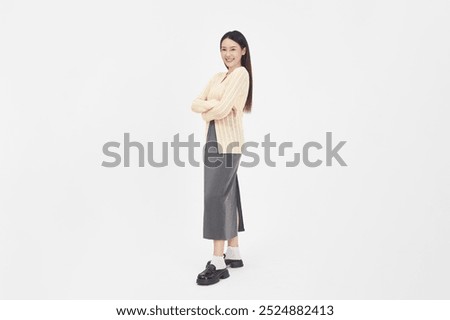 Similar – Image, Stock Photo Young woman stands leaning against a bale of straw in the field and smiles