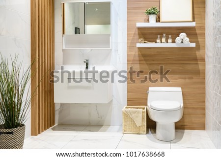 Modern spacious bathroom with bright tiles with toilet and sink. Side view Foto stock © 