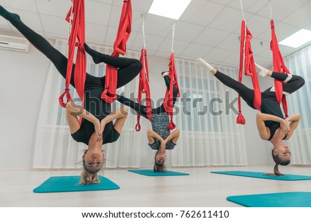 Charming young girls practicing relaxing yoga in the air. Fitness. Healthy lifestyle. Yoga classes Imagine de stoc © 