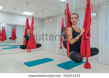 Fitness womans doing relaxing yoga in the air. Beauty. Health Imagine de stoc © 
