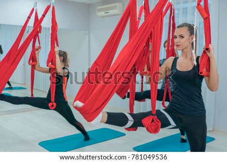 Charming young girls practicing relaxing yoga in the air. Fitness. Healthy lifestyle Imagine de stoc © 