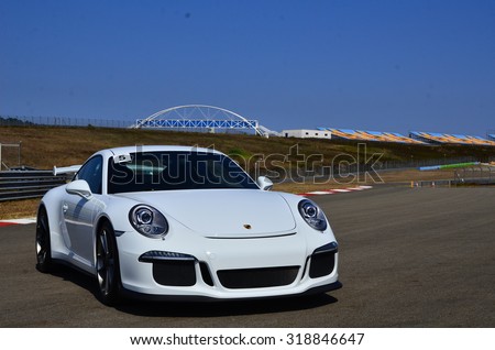 Istanbul, Turkey-July 30, 2015: Very fast white sports car parked on race track short-cut area.That has ready for track race on July 30, 2015 in Istanbul, Turkey speedway.