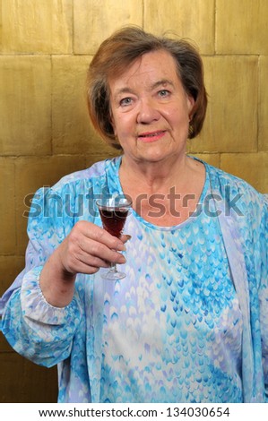 Senior woman with wine glass