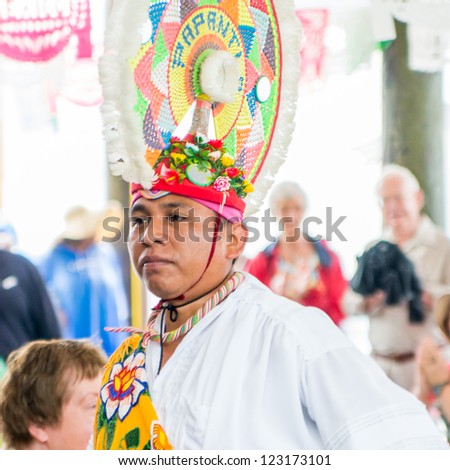COZUMEL - DEC 12: Mayan dancer performs in Cozumel on December 12, 2012. Dance is still a central component of social and political life for the Mayan and their mixed  Maya-Catholic ritual practices.