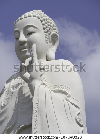MY THO, VIETNAM - FEBRUARY 26: A large white Buddha, February 26, 2014 dominates the skyline in My Tho, Vietnam. My Tho is a popular tourist attraction in Vietnam and gives access to the Mekong Delta.