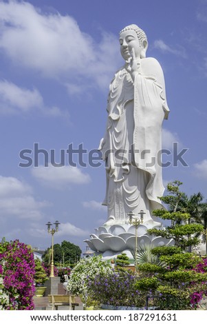 MY THO, VIETNAM - FEBRUARY 26: A large white Buddha, February 26, 2014 dominates the skyline in My Tho, Vietnam. My Tho is a popular tourist attraction in Vietnam and gives access to the Mekong Delta.