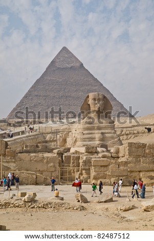 GIZA, EGYPT - NOV 15:  Both tourists and locals visit the Pyramids and Sphinx on November 15, 2010, at Giza, Egypt. The world\'s oldest tourist attraction, the Pyramids of Giza are 5000 years old.