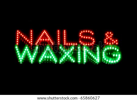 Nails and waxing beauty therapy sign isolated on black background