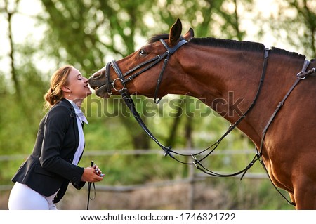 Similar – Foto Bild Mädchen, das ein Pferd küsst.