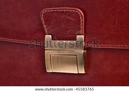 Leather bag lock closeup - horizontal orientation.