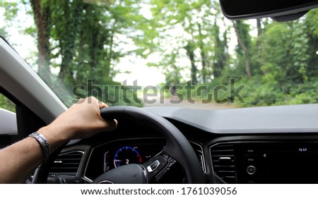 Similar – Image, Stock Photo Man driving from behind