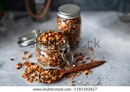 Similar – Image, Stock Photo Granola on a golden plate with a wooden spoon, rustic background