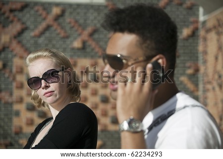 man on the phone while she gets angry 3837