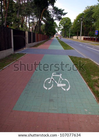 way of a separate bicycle path and sidewalk, bike path markings