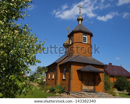 picturesque wooden Orthodox church in the village Kostomloty in eastern Poland on the border with Belarus