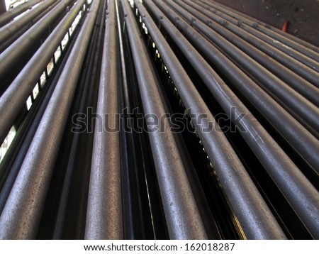 evenly stacked steel tubes of the heat exchanger, the water heater in the boiler grate as background