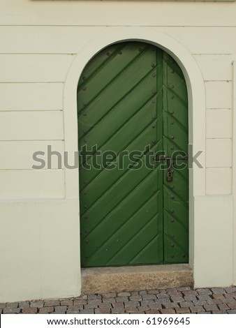 Simple wooden doors to the business premises of the castle