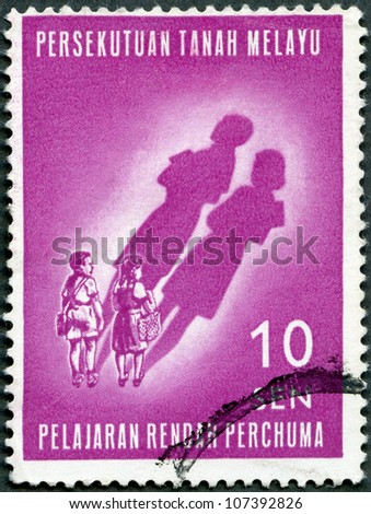MALAYA - CIRCA 1962: A stamp printed by Malaya shows Children and their Future Shadows, Free primary education introduced January 1962, circa 1962