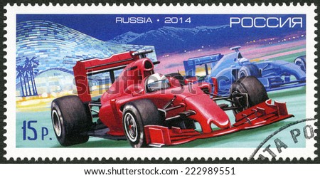 RUSSIA - CIRCA 2014: A stamp printed in RUSSIA shows car of Formula One against the Iceberg Skating Centre in the Sochi, circa 2014