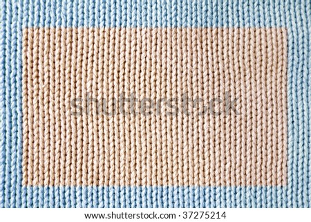 Knitted fabric - macro of a woolen texture
