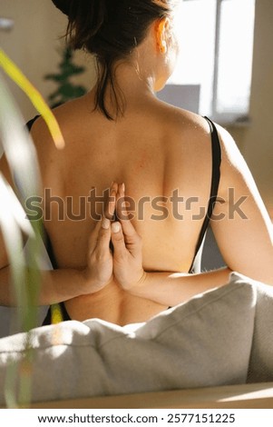 Similar – Image, Stock Photo Anonymous woman stretching body in seated forward bend position