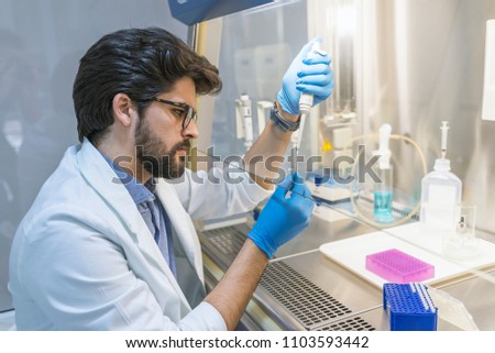 Similar – Image, Stock Photo Serious clinician studying chemical element in laboratory