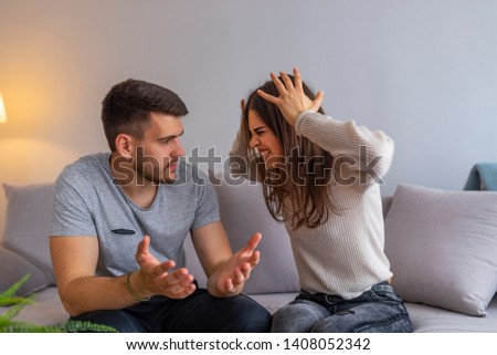 Attractive angry couple fighting and shouting at each other. Couple fight hard in the morning. Couples are angry with love issues. Not understanding each other in family problems or infidelity  Foto stock © 