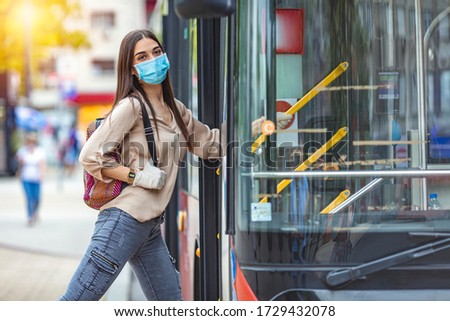 Similar – Image, Stock Photo Serious passengers in protective masks during their train trip