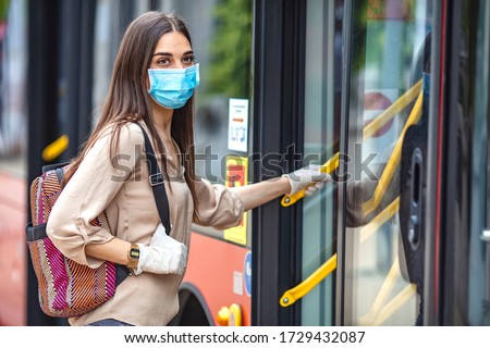 Image, Stock Photo Serious passengers in protective masks during their train trip