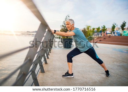 Similar – Foto Bild Sportlerin schaut auf eine flexible Freundin, die Übungen auf dem Luftseil ausführt