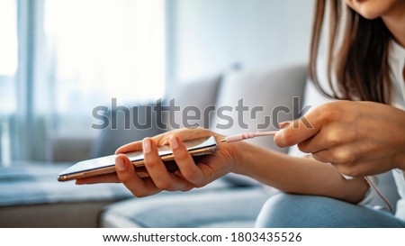 Similar – Image, Stock Photo woman charging batteries in the middle of nature