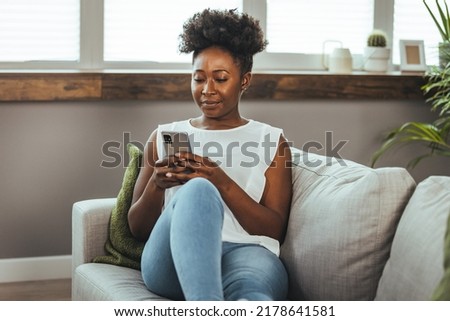 Similar – Image, Stock Photo Young african woman looking serious to camera during a exercise session in the city, urban style image, sport and activities in the city, copy space