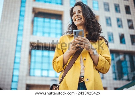 Similar – Image, Stock Photo young woman wearing yellow raincoat standing next to hammock with her jack russell dog. autumn season. camping concept