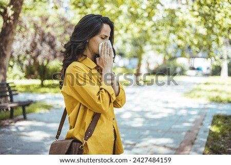 Similar – Image, Stock Photo Young woman smelling flower in the field