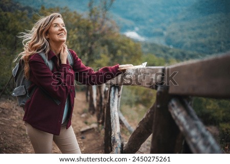 Image, Stock Photo backpacker woman hiking outdoors with cute poodle dog. Snowy mountain in winter season. nature, pets and lifestyle